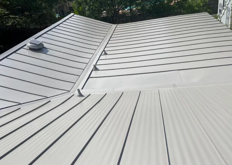 Solar attic fan installed on a metal roof for Roof Ventilation in New Kensington